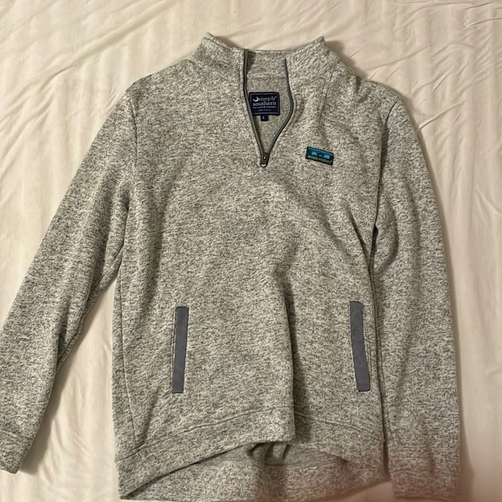 Gray 1/4 zip sweatshirt.